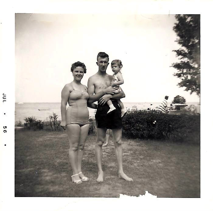 Cathy with parents 2.5 years old